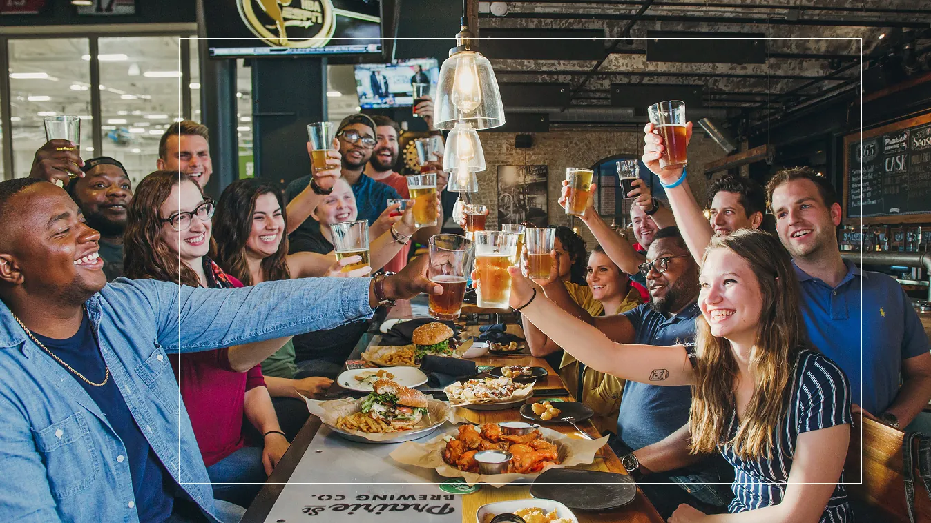 People enjoying a meal & drinks at Prairie Street Brewing Company